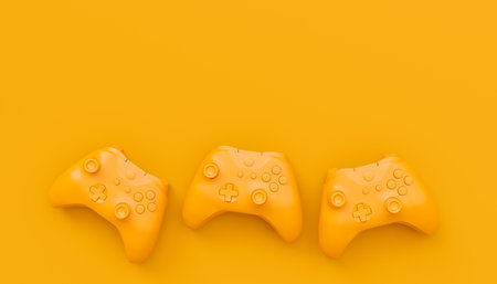 Video game joysticks or gamepads in plain monochrome yellow color background with copy space. 3D...