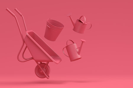 Garden wheelbarrow with garden tools like shovel, rake and fork on monochrome background. 3d render concept of horticulture and farming suppliesの写真素材