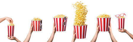 Woman hand taking popcorn from striped bucket isolated on white background. Isolated with clipping path.の写真素材
