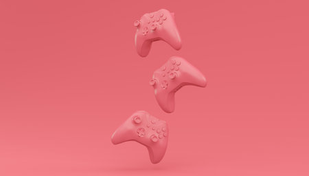 Video game joysticks or gamepads in plain monochrome pink color background with copy space. 3D...