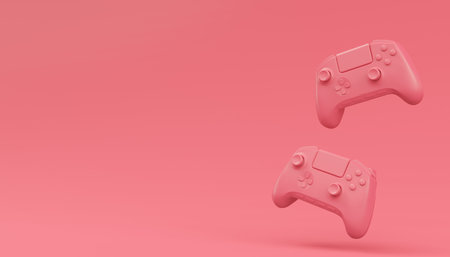 Video game joysticks or gamepads in plain monochrome pink color background with copy space. 3D render of streaming gear for cloud gaming and gamer workspace conceptの写真素材