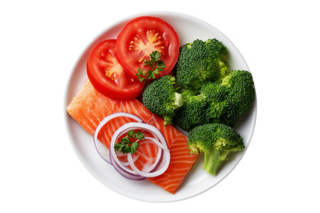 Grilled salmon fillet served with fresh broccoli, tomatoes, onion and cherry tomatoes isolated on white background, concept of healthy balanced dietの素材