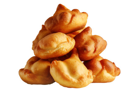 Sopaipillas fried dough or bread, sweet or savory stacked together, isolated on white transparent background. Concept of Mexican traditional homemade snack or street foodの素材