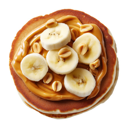 Stack of pancakes with banana slices, creamy peanut butter, and chopped peanuts isolated on white transparent background, concept of delicious breakfast mealの素材
