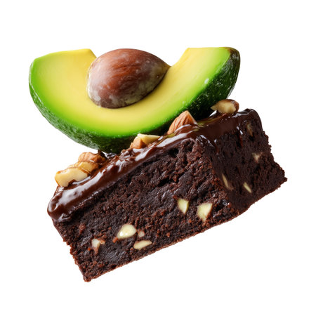 Chocolate brownie with avocado slices, pecans, chopped nuts, and mint leaf on white transparent background, concept of healthy dessertの素材