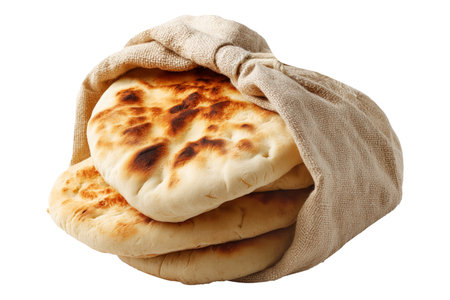Traditional pita bread or flatbreads some floating above a sack, isolated on white transparent background. Concept of Arabic Cuisine and fresh bakeryの素材
