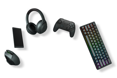Gaming accessories including keyboard, controller, headset, mouse, and phone isolated on white...