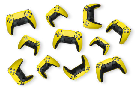 Wireless gaming controllers flying in air isolated on white background with clipping path,...