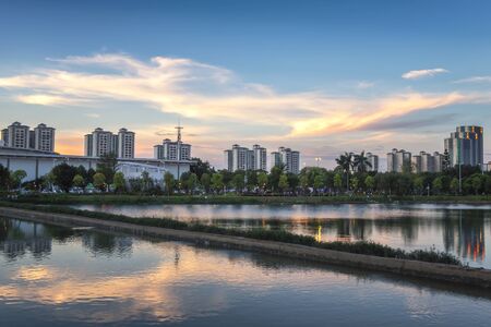 Evening buildings and sunset in Denenghu Park, Zhongshan, Guangdong, Chinaのeditorial素材