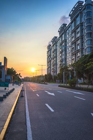 Evening sunset illuminates city roads and buildingsのeditorial素材