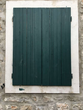 Green textured wooden Mediterranean window