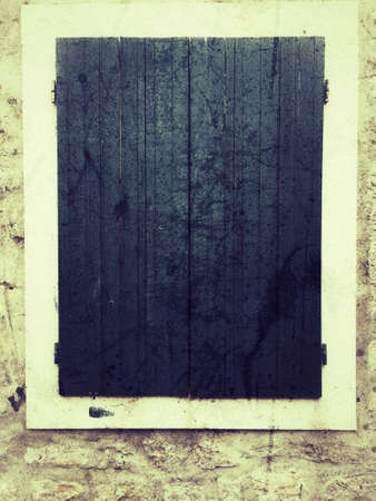 Shutter blue wooden window, grunge backgroundの写真素材
