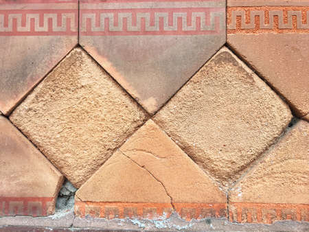 Red tiled stone wall
