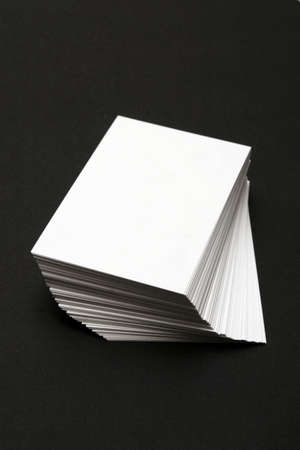Stack of White cards against a black backgroundの写真素材