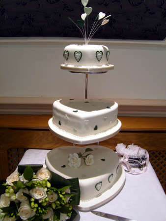 Three Tiered Heart Wedding Cake and Bouquetの写真素材