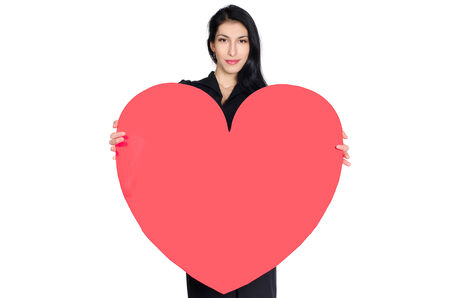 sensual brunette in black dress with  heart made ââof paper in hands isolated on white backgroundの写真素材