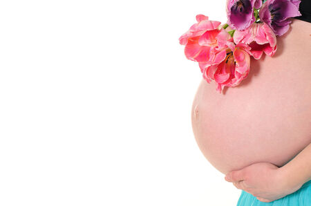 Pregnant belly closeup, studio shot on white background