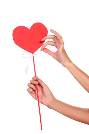 Hands closeup holding  sign of heart on white studio backgroundの写真素材