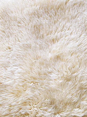 The wool texture of a fluffy sheepsking rug の写真素材