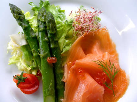 A plate of asparagus and smoked salmon ready to serveの写真素材