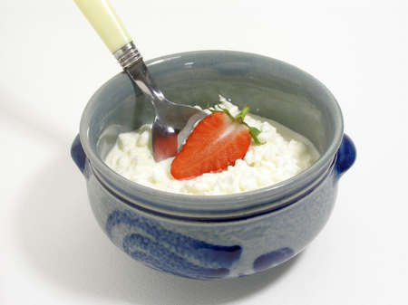 Cottage cheese served for breakfast with strawberryの写真素材