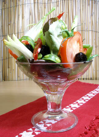 Selection of raw vegetables served in a cocktail glassの写真素材