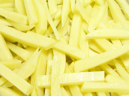 Bed of french fries, cut to be friedの写真素材