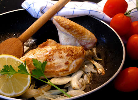 Breast of chicken with lemon and onionの写真素材