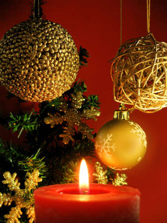 Christmas decoration with a red candleの写真素材