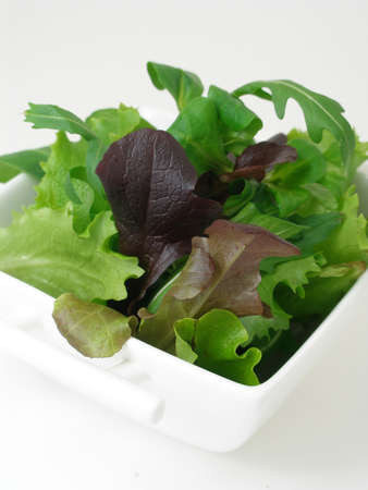 Green salad in a white china bowlの写真素材