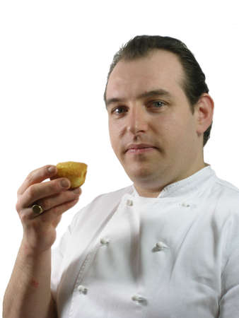 Chef Gabriel is testing a small cakeの写真素材