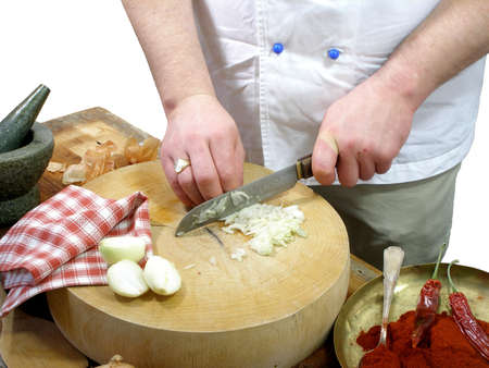 a chef is chopping onionsの写真素材