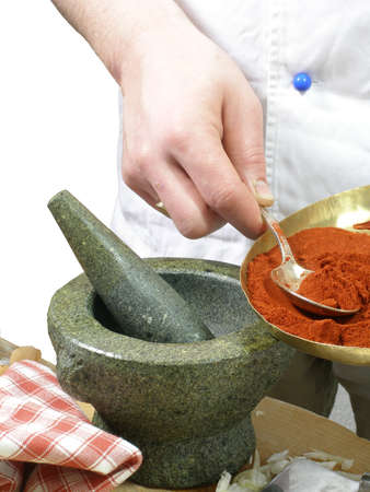 Chef is using a mortarの写真素材