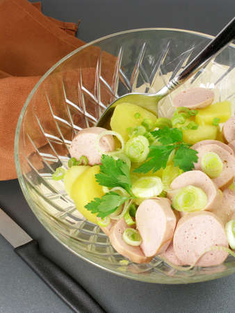 Preparation of a sausage and potato salad      の写真素材
