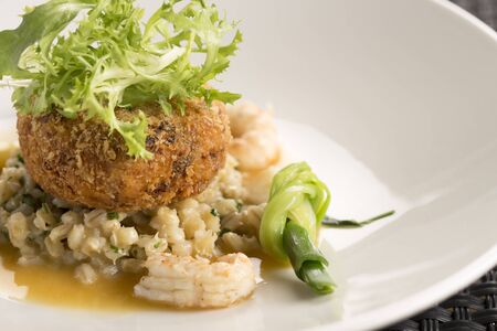 Langoustines, Pork belly beignet, pearl barley & shellfish butter