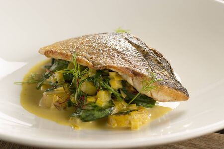 Seabass with leek & potato saffron broth