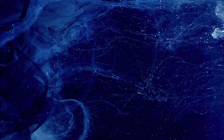 Blue watercolor ink in water on a black background. Colored space magic background. Digital strings...