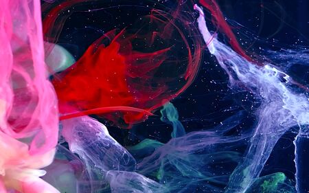 Colored watercolor ink in water on a black background. Space futuristic magic background. Digital...