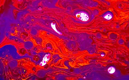 Orange and purple watercolor ink in water and oil. Amazing futuristic background. Planets, the...
