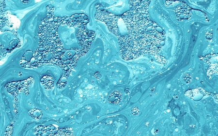 Turquoise watercolor ink in water with oil. Futuristic trend background. Planets, the universe and...