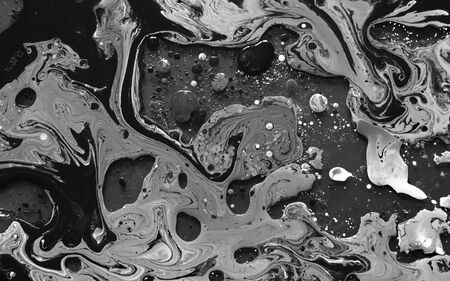 Black and white watercolor ink in oil water. Cool trending screensaver. Abstract trending...