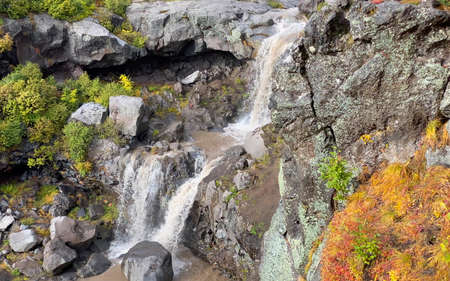 Close-up of amazing two-stage waterfall. Stunning autumn landscape. Beautiful place. Travel to the...