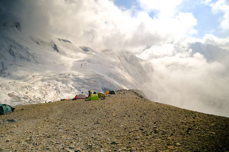 Amazing landscapes of North Ossetia. Snow-capped mountains, blue sky and white clouds. Climbing...
