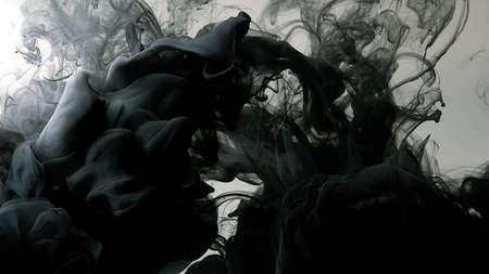 Beautiful wallpaper for your desktop. Awesome abstract background. Black cloud of ink on a white background. Drops of black ink in water. Cosmic star background. Environmental pollution concept.の写真素材