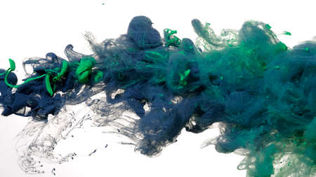Colored acrylic paints in water. Gray-blue and green watercolor ink in water on a white background....