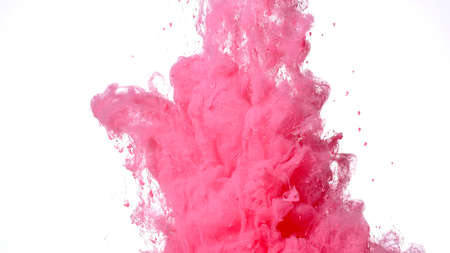 Fantastic abstract background. Pink paints are mixed in water. Colored cloud of ink on a white background. Pink watercolor ink in water on a white background.の写真素材