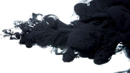 Abstract background. Drops of black ink in water. Colored acrylic paints in water. Black watercolor ink in water on a white background. Black cloud of ink on a white background.の写真素材
