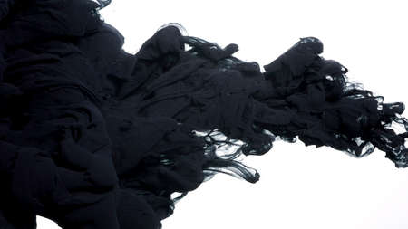 Colored acrylic paints in water. Black watercolor ink in water on a white background. Black cloud of ink on a white background. Abstract background. Drops of black ink in water.の写真素材