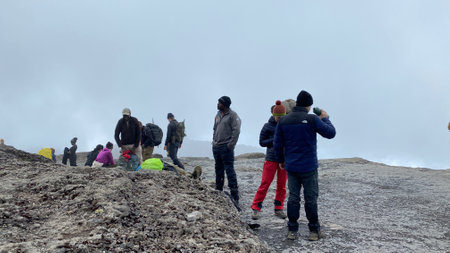 Kilimanjaro, Tanzania - December 28, 2021: Tourists rest after a hard day. Foggy mountain landscape. Climbing Kilimanjaro, Africa.のeditorial素材