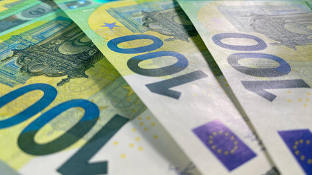 Several banknotes of 100 euros lie in a fan. Single currency of the European Union. cash banknotes....